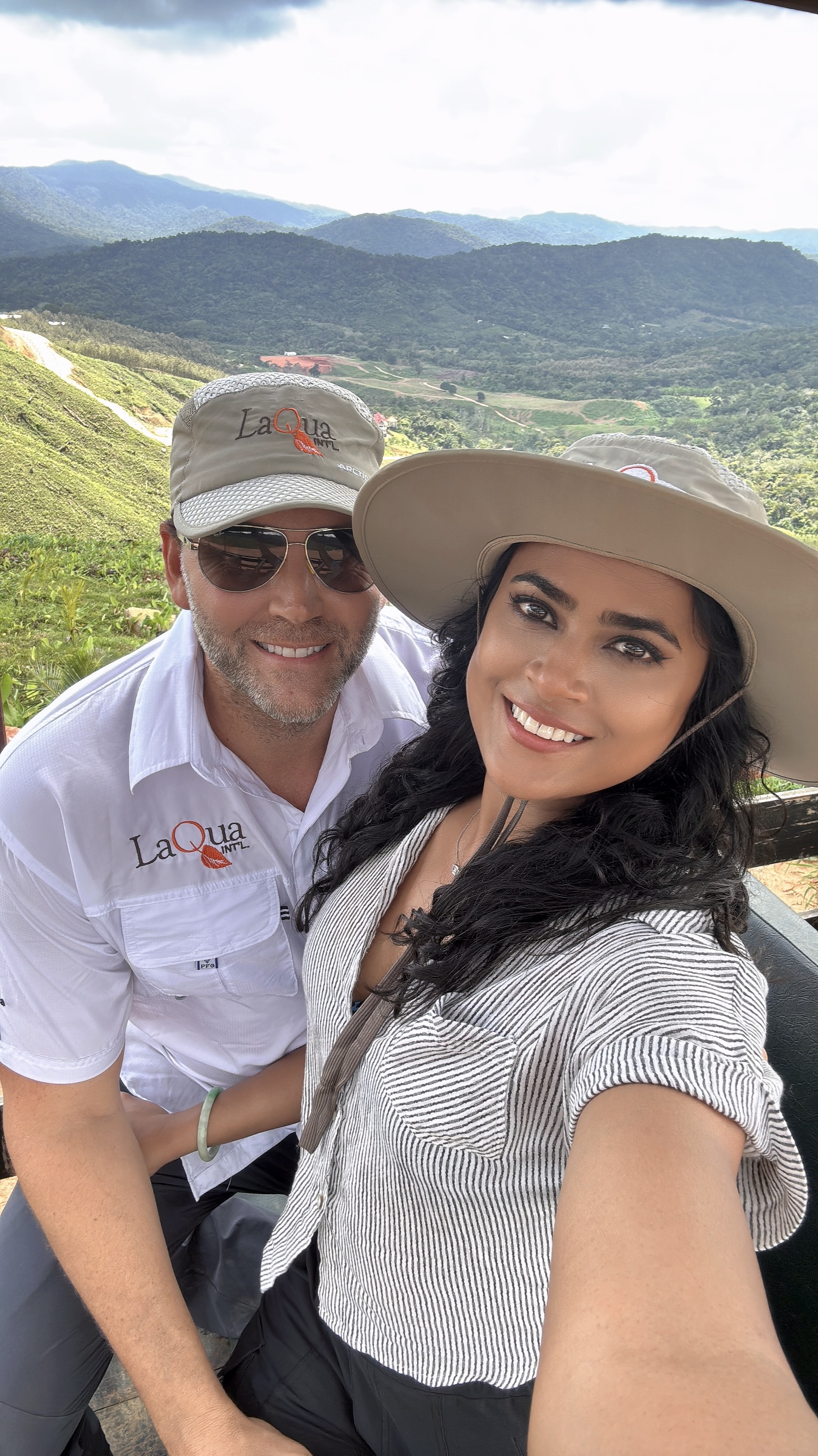 David and Lovina smiling together overlooking the Belize mountains and LaQua developments