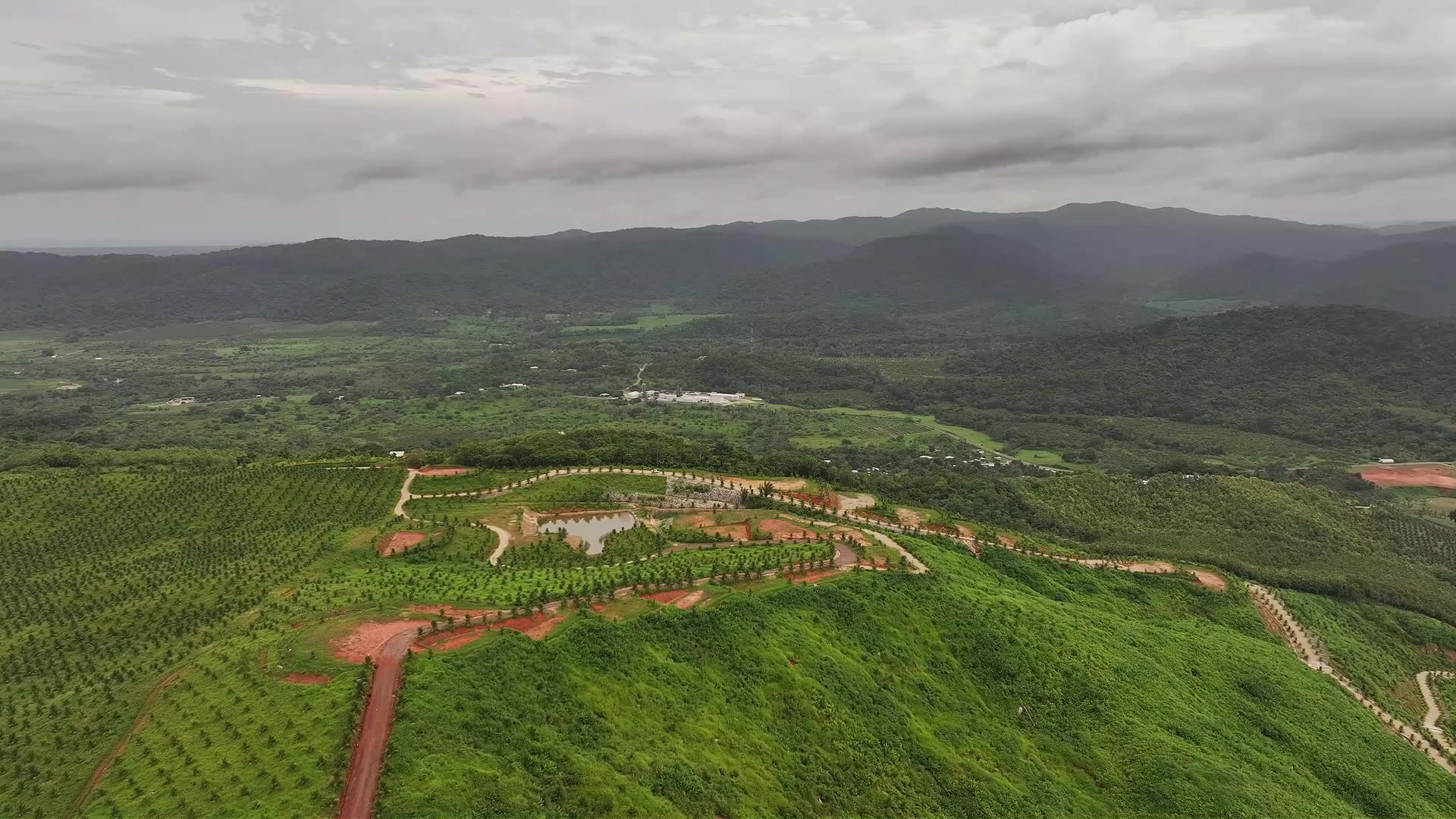 Aerial photograph of LaQua’s mountain homesite development surrounded by green hills